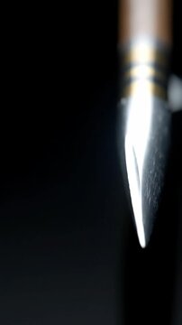 Arrow tip detail on black background