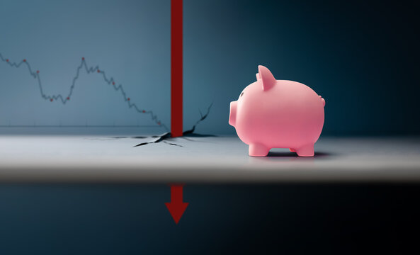Piggy bank with downward market graph and arrow.economic crisis, financial downturn, market volatility