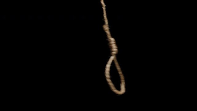 A Noose Swinging On A Black Background, Concept Of Limitation Of Freedom, Slavery.