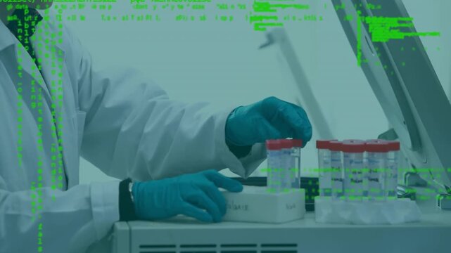 Animation of data processing over mid section of male scientist working at laboratory