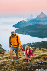 Fototapeta premium Family on summer vacations in Norway father and daughter child hiking in mountains travel together, parent and kid on adventure trip healthy lifestyle hobby outdoors, Helgeland islands view