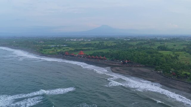 Aerial view of kedungu beach with mount agung in bali