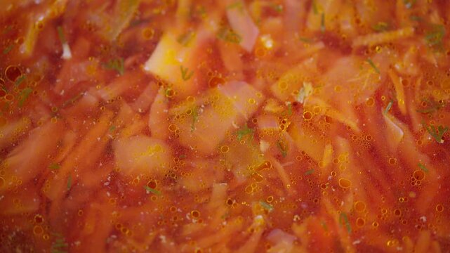 Hearty beet soup. Rich broth with shredded beets and tender vegetables simmering. Comforting bowl of red borscht featuring fresh herbs and fragrant spices in meat stock