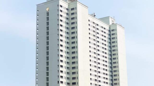 Cinematic drone shot of high rise apartment building