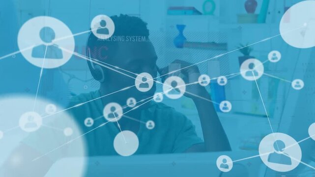 Animation of network of profile icons ove rafrican american man talking on phone headset at home