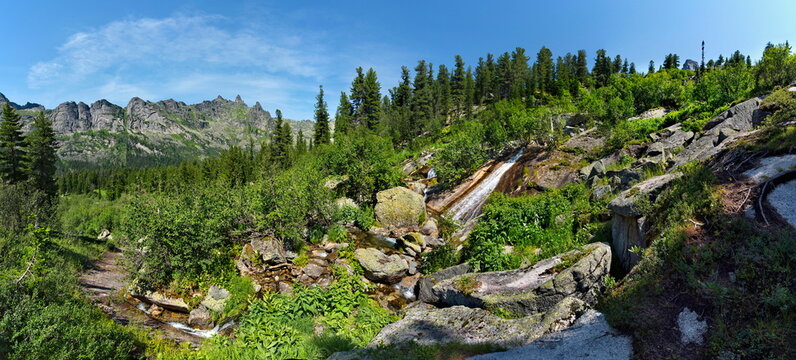 Russia. South of Siberia. Western Sayans. Numerous cascading waterfalls of the Taigish River in the Ergaki Natural Mountain Park.