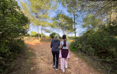 Fototapeta premium Young mother and daughter hiking