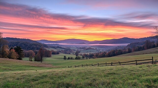 Picturesque sunrise over rolling hills and meadows.