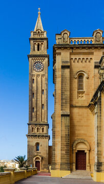 Historic Church Clock Tower And Stone Facade Against Clear Blue Sky, Mediterranean Architecture