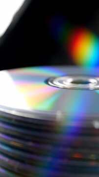 Stack of CDs DVDs with iridescent surface