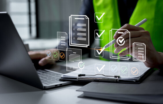 Engineer using digital technology to review a construction safety checklist and approve inspection results, ensuring compliance, quality control, and secure project management.