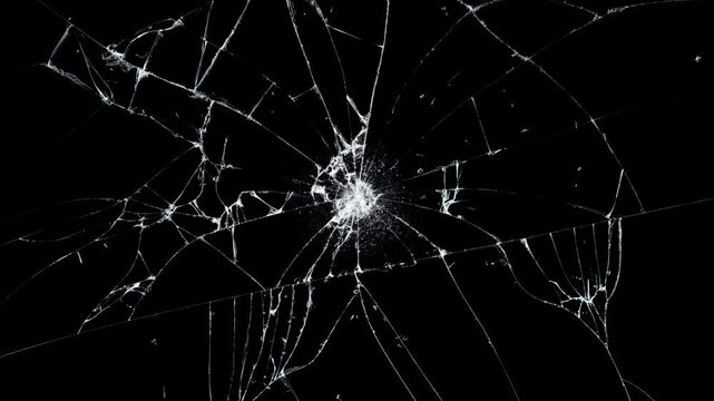 Cracked glass fracture effect on black background. Breaking glass motion graphics.Motion graphics with cracking and breaking glass surfaces. Dynamic cracked screen overlay.