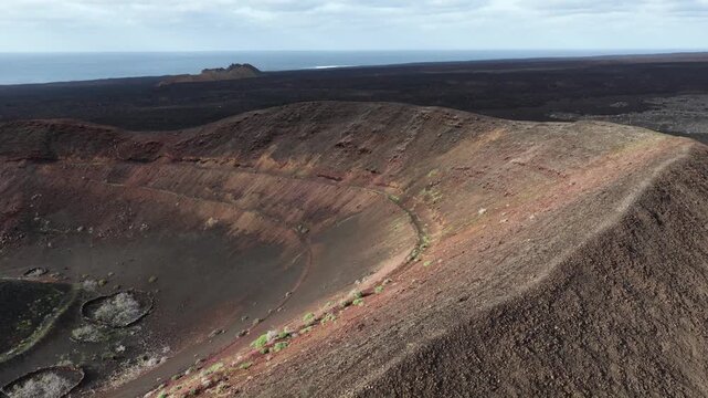 Observing Lanzarote's volcanic crater and ocean from above