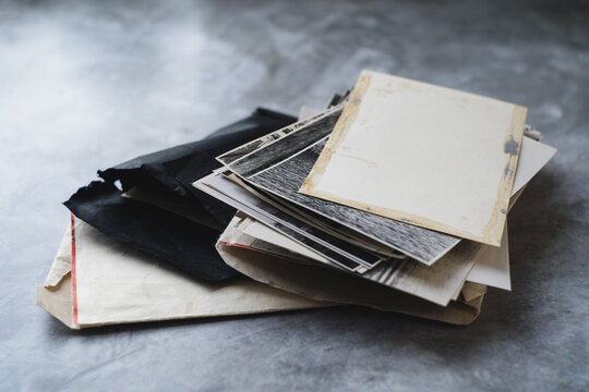 Old black and white photos on the table.Archive photos.