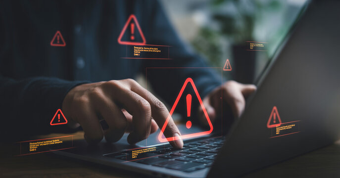 Cyber security alert warning and error on laptop screen by user