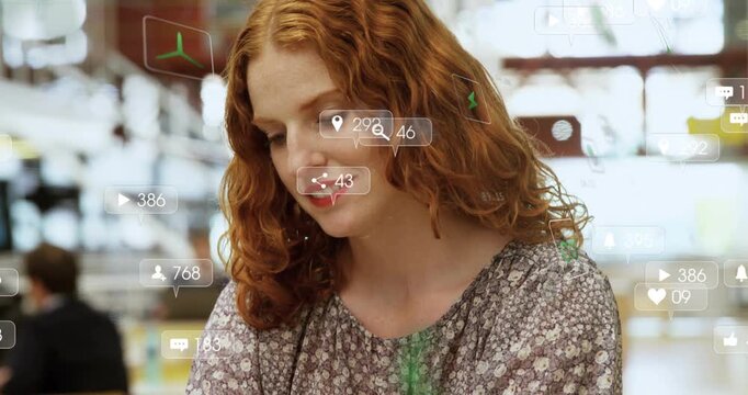 Woman at table scrolling phone, animated social alerts rising by phone, making her lift and laugh