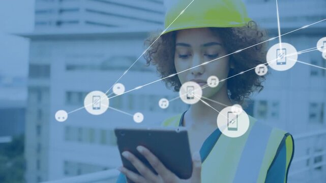 Vertical video: Tapping tablet woman in safety vest hardhat making network on roof checking site