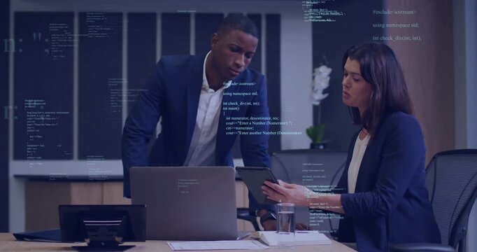 Man leaning in, woman rotating tablet, man pointing, both reviewing UI code overlay for tech review