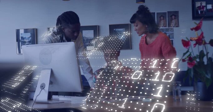 Team reviewing data at desk, seated operator tapping phone and initiating business data overlay