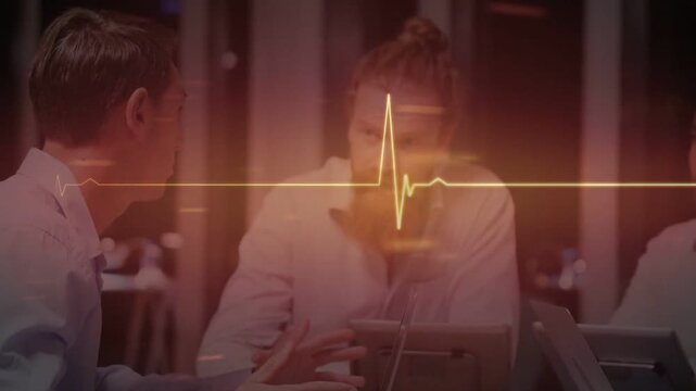 Left man gesturing, causing center tapping tablet in healthtech meeting, yellow ECG syncing