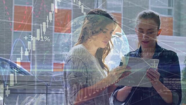 Two women outside viewing tablet, left woman tapping phone causing finance charts for analysis