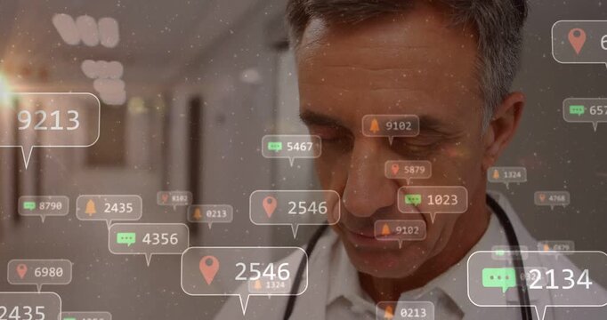 Vertical video: Walking doctor in white coat lifting head with alerts building up in hospital hall