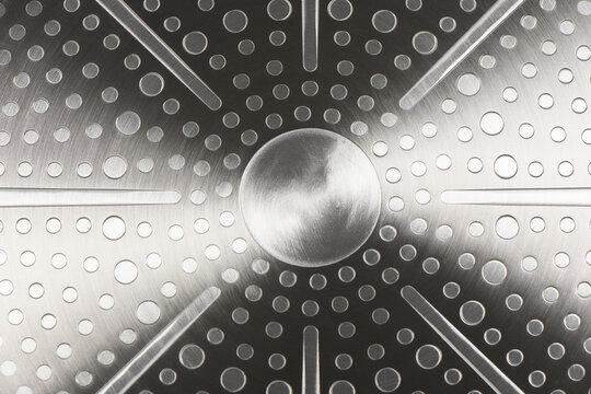 Stainless steel induction cookware bottom texture background