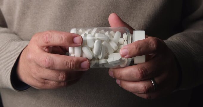 Still life of human interaction with drugs. Ideal for representing health habits, patient records, pharmacy sales and medical education projects.