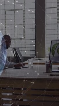 Analyst typing in tech office activating graph overlay smiling at offscreen prompt resuming typing