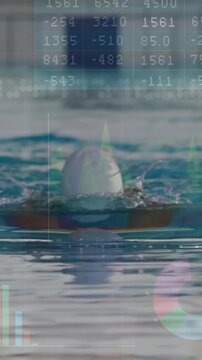 Vertical video: Swimmer swimming to lens rising to inhale, doing breaststroke to track metrics