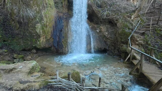 Side View of Forest Waterfall from Bottom to Top Slow Upward Move. Ozren Mountain, Sokobanja region (Ripaljka Waterfall). Balkans, Serbia.