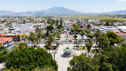 Obraz premium Xalisco town square with church and sanganguey volcano