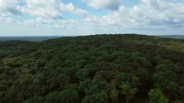 Aerial flying over the expansive wilderness of crown land located in the Tory Hill area of Highlands East, in southern Ontario, Canada. 