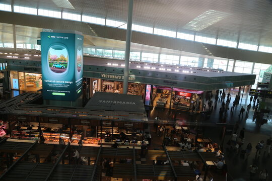 Charlotte, NC - June 12, 2025: Busy CLT Airport Terminal Interior with Arched Ceiling and Travelers.