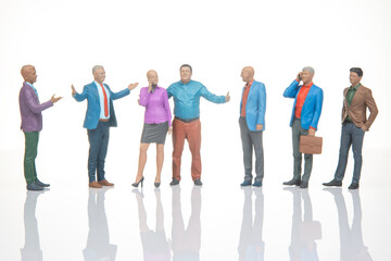 Fototapeta premium Miniature figurines of people engaging in conversation and interaction in a simple setting