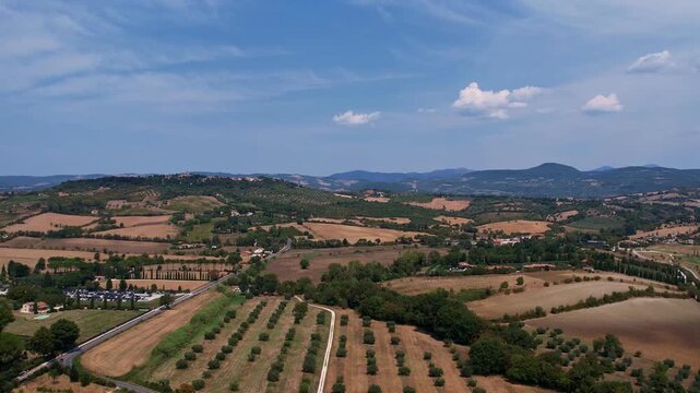 drone footage of rolling hillside landscape of tuscany, italy
