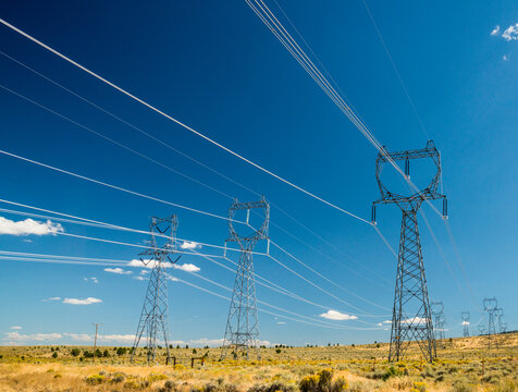 USA, OR, Bend.  High voltage transmission towers carry electricity from the Columbia River hyrdo power stations to cities in the south.