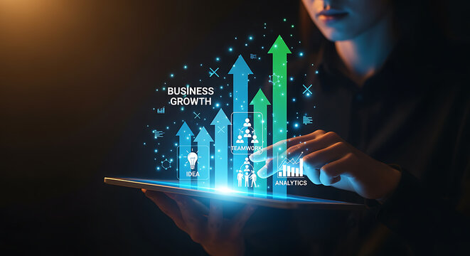 A person is viewing a tablet with business growth charts and graphs displayed.