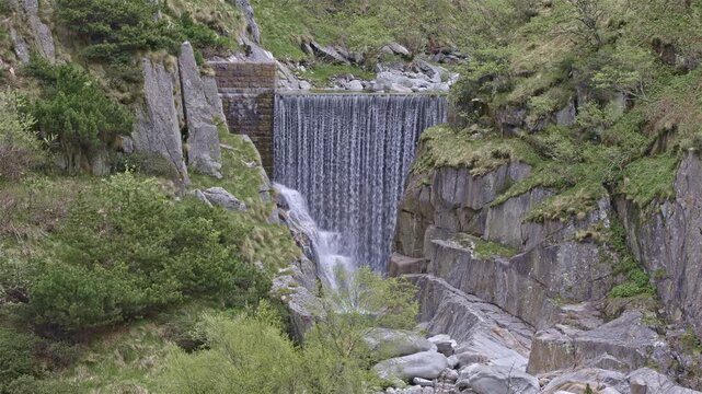 The Reuss man-made cascade in the Schoellenen Gorge, an engineered drop in the river near the Devil&rsquo;s Bridge, Canton of Uri, Switzerland.