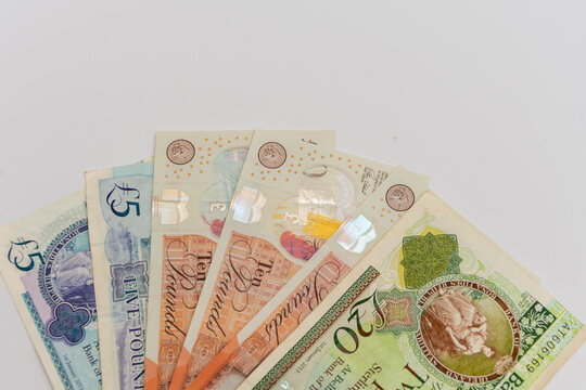 British pound sterling banknotes arranged in fan symbolizing UK finance and economy