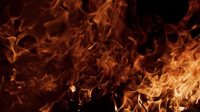 Fire flames with strong glow. Fire burning dark scene. Fire blazing dramatic energy. Fire abstract flame wallpaper.