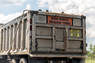 Dump truck construction vehicle trailer with warning sign for frequent stops turns, we are not responsible for broken windshield, maintain distance