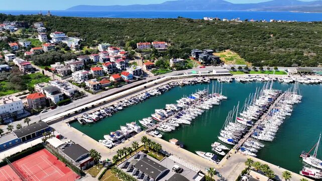 Peaceful Aerial View of Teos Marina and Sığacık, Izmir Turkey - Aerial view of Teos Marina and Sığacık in Izmir, Turkey, featuring a peaceful harbor, boats and clear blue Aegean Sea.