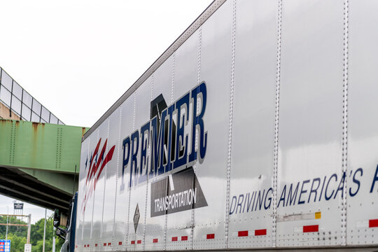 Woodbridge, USA - May 27, 2025: Virginia highway i95 interstate by Washington DC with Premier sign on truck side and America's drivers text