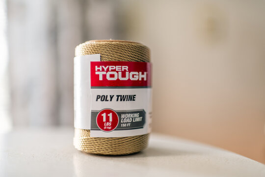 Roseland, USA - February 13, 2025: Thread polytwine poly twine rope on spool closeup of string studio shot by Hyper Tough brand