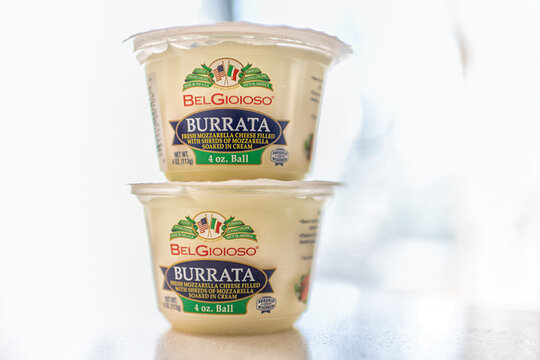 Roseland, USA - March 10, 2025: Closeup of two buratta mozzarella cheese ball product label made in Wisconsin, Italian style with BelGioioso brand