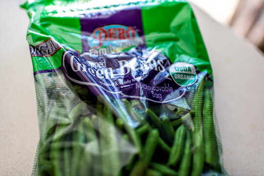 Roseland, USA - March 14, 2025: Pero Family farms brand of snipped usda organic green beans vegetable in plastic bag washed produce