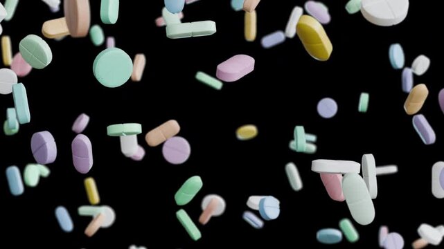 Assorted pills, capsules and tablets falling downward in endless loop. Medical animation with alpha channel isolated on transparent background for healthcare and pharmaceutical use.