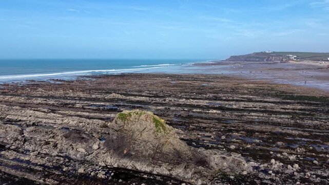 Panning back to reveal Widemouth Bay beach in Cornwall