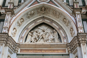 Fototapeta premium Ornate colorful marble facade of the Basilica di Santa Croce in Florence, Italy
